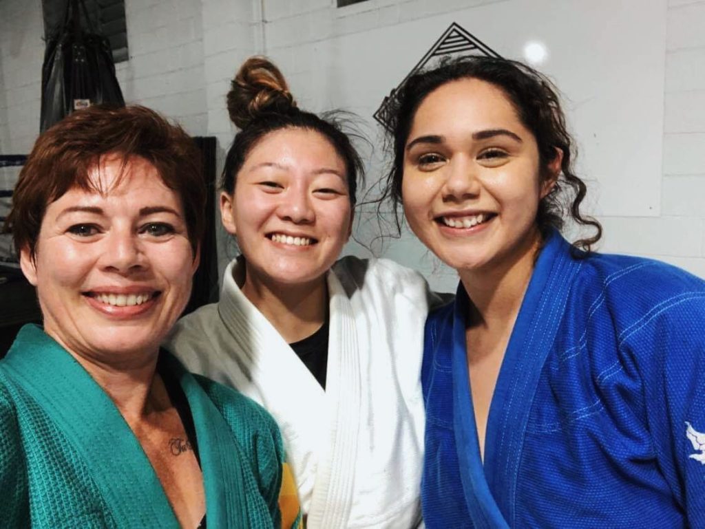 Steph Chan poses with her friends after a Brazilian Jiu Jitsu class